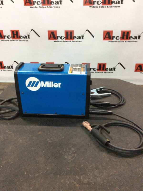 A blue and black machine sitting on top of a table.