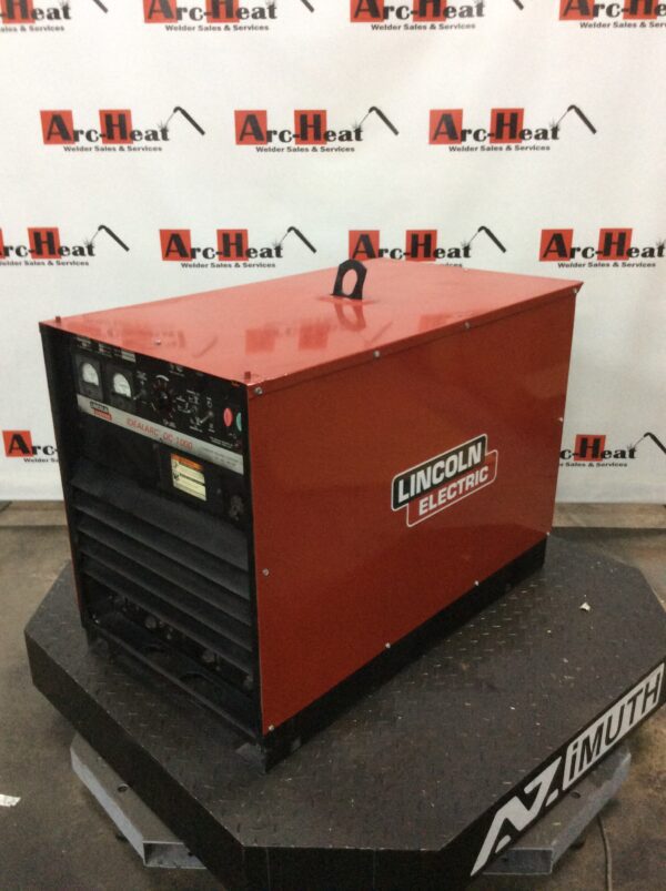 A lincoln electric welding machine sitting on top of a table.