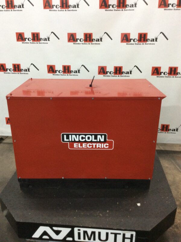 A red lincoln electric box sitting on top of a table.