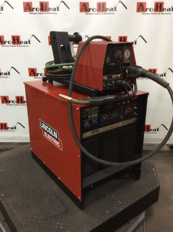 A Lincoln Idealarc CV-400 MIG Welder with a hose attached to it.