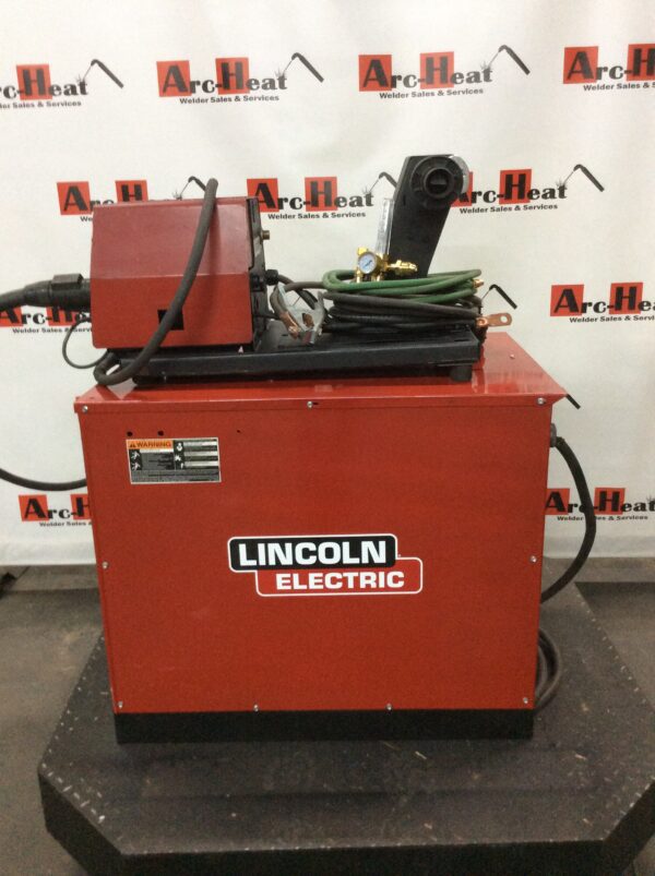 A Lincoln Idealarc CV-400 MIG Welder on a stand.