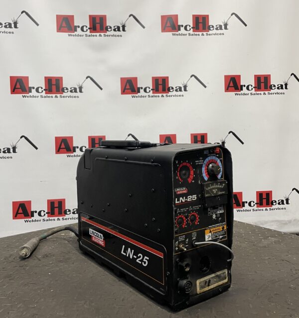 LN-25 welding machine on display stand.