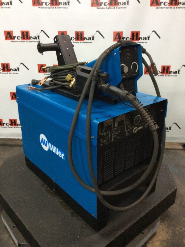 Blue Miller welding machine with hoses.