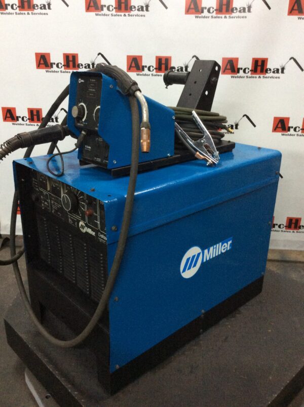 Blue Miller welding machine with hoses.