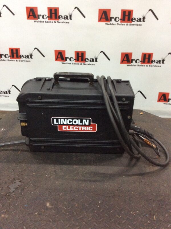 A Battery in Black Color in Lincoln Electric With Wording